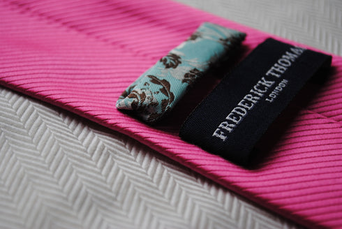 bright pink tie with a very subtle stripe