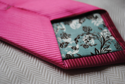 bright pink tie with a very subtle stripe