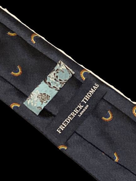 navy tie with embroidered rainbow design