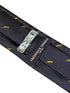navy tie with embroidered trumpet design