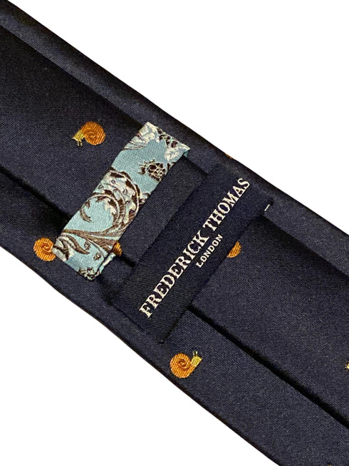 navy tie with embroidered snail design