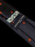navy tie with embroidered ladybird design