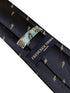 navy tie with embroidered New Zealand feather silver fern design