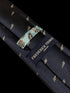 navy tie with embroidered New Zealand feather silver fern design