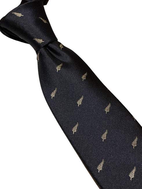navy tie with embroidered New Zealand feather silver fern design