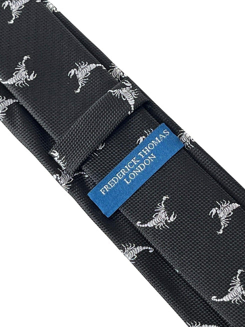 Black tie with white embroidered scorpion design