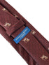red maroon tie with embroidered lion design