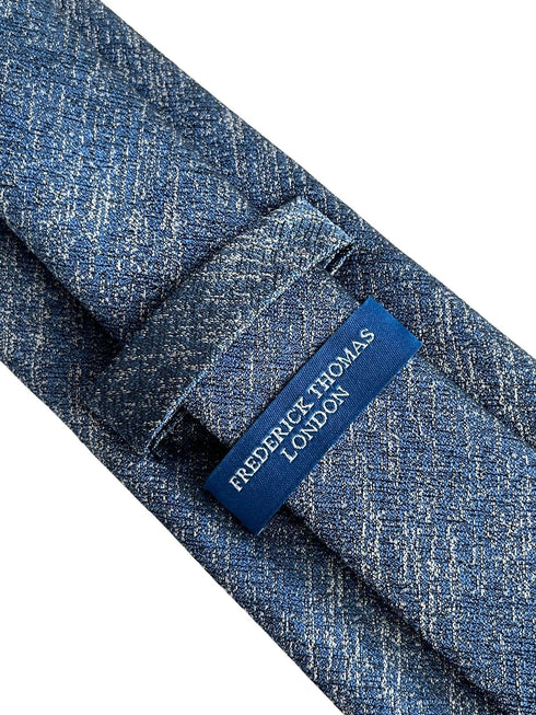 medium blue and white tie with scratched design