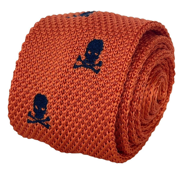 orange knitted tie with embroidered navy skull and crossbone design