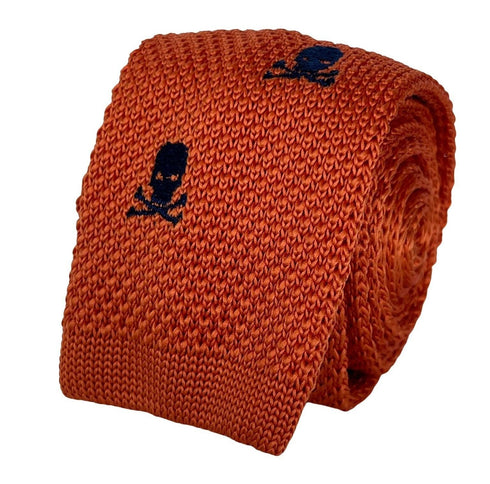 orange knitted tie with embroidered navy skull and crossbone design