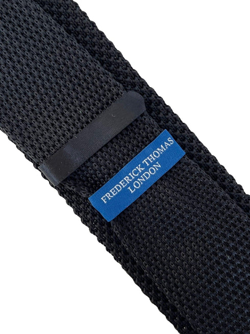 black knitted tie with white elephant embroidered design