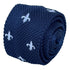 navy blue knitted tie with white embroidered fleur de lis lys design