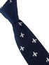 navy blue knitted tie with white embroidered fleur de lis lys design