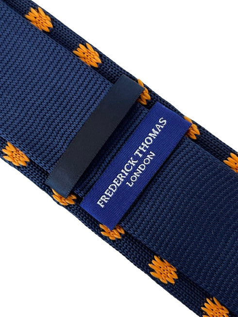 navy blue knitted tie with golden sunflower embroidered design