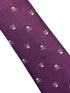 purple tie with white skull and crossbone design