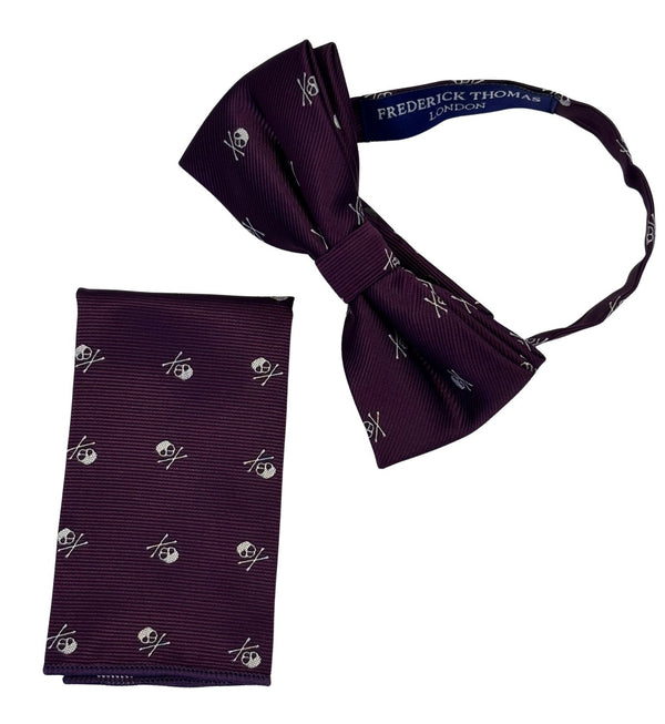 matching purple bow tie and pocket square with white skull and crossbone design