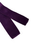 purple knitted tie with white polka spot design
