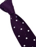 purple knitted tie with white polka spot design