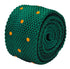knitted tie in emerald green with an orange polka spots design