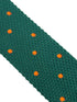 knitted tie in emerald green with an orange polka spots design