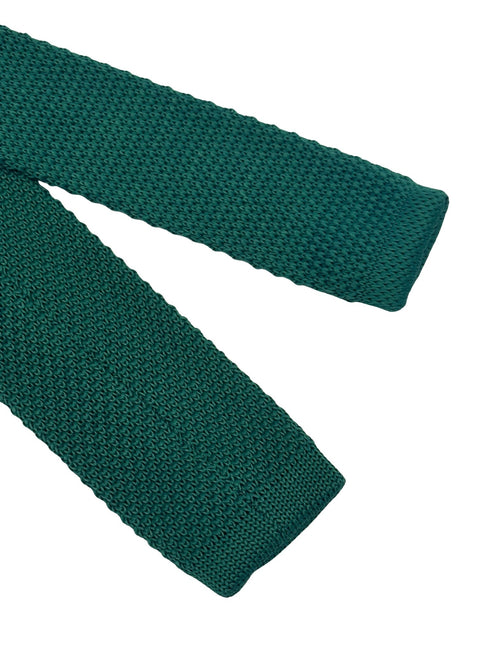 knitted tie in emerald green with an orange polka spots design