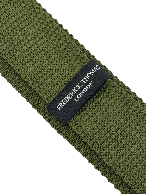 knitted tie in khaki green with white polka dots