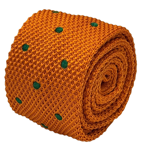 knitted tie in bright orange with emerald green polka dots