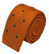 knitted tie in bright orange with emerald green polka dots