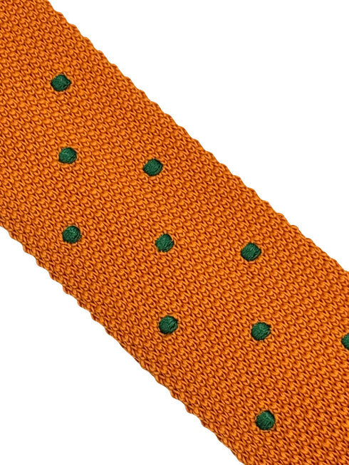knitted tie in bright orange with emerald green polka dots