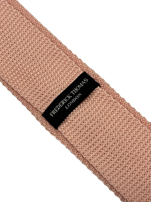 knitted tie in baby light pale pink with dark navy blue spots