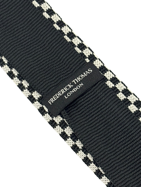 knitted tie with black and white check design