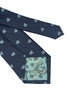navy blue tie with light blue flying pig design