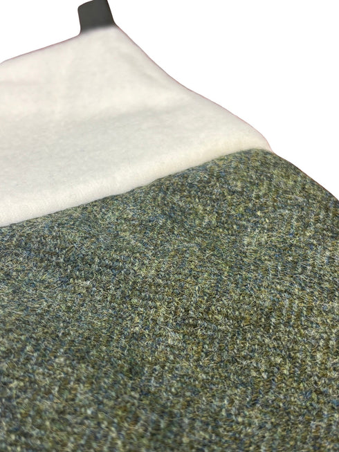 tweed wool Christmas stocking in plain dark forest green herringbone design