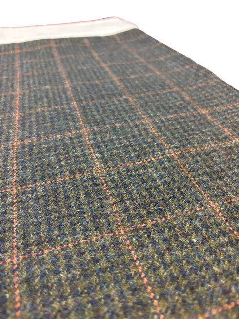 tweed wool Christmas stocking in green with orange gold windowpane