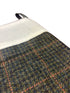 tweed wool Christmas stocking in green with orange gold windowpane