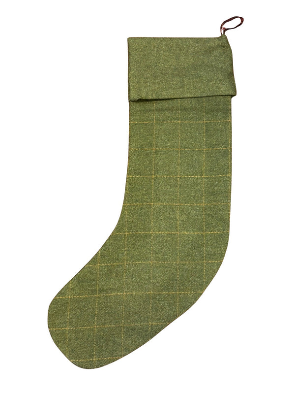 tweed wool Christmas stocking in green with orange gold windowpane and green top