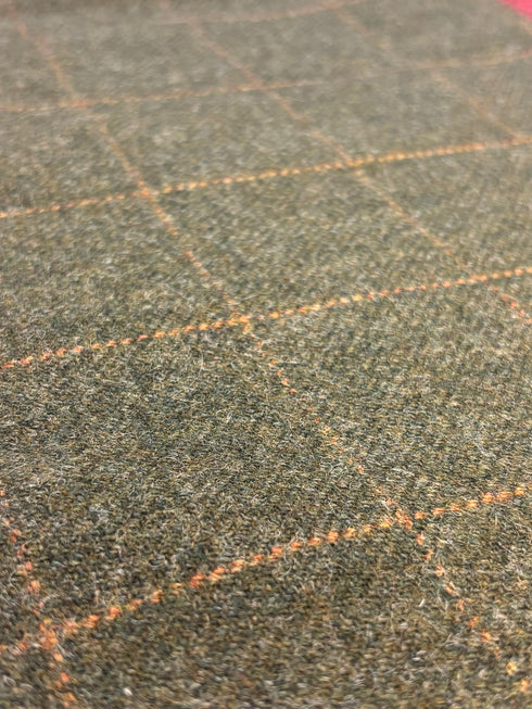 tweed wool Christmas stocking in green with orange gold windowpane and green top