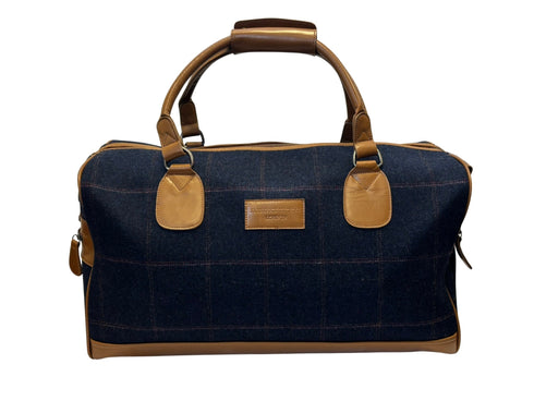 Luxury weekend overnight bag in navy blue check with tan leather handles