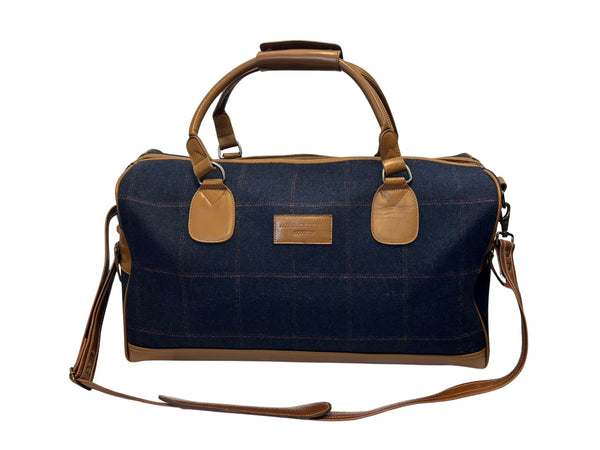 Luxury weekend overnight bag in navy blue check with tan leather handles