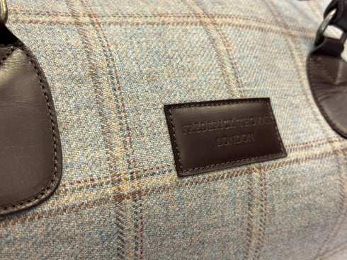 Luxury weekend overnight bag in light blue check with leather handles