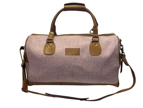 Luxury weekend overnight bag in pale pink with leather handles