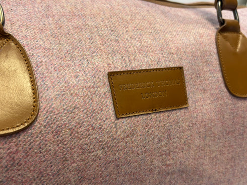 Luxury weekend overnight bag in pale pink with leather handles