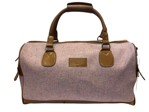 Luxury weekend overnight bag in pale pink with leather handles