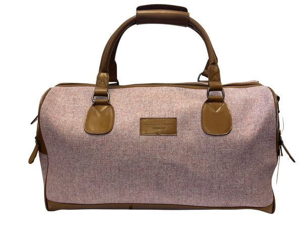 Luxury weekend overnight bag in pale pink with leather handles