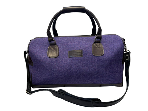 Luxury weekend overnight bag in purple with leather handles