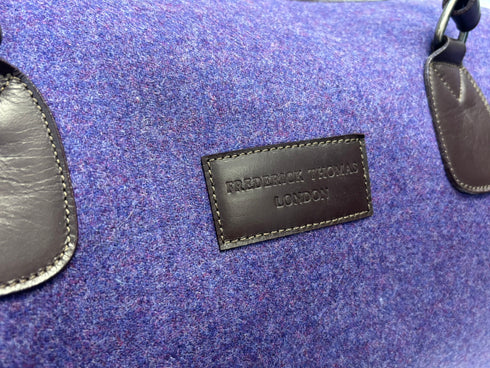 Luxury weekend overnight bag in purple with leather handles