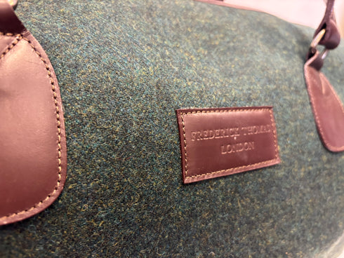 Luxury weekend overnight bag in dark forest green with leather handles