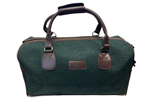 Luxury weekend overnight bag in dark forest green with leather handles