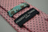 pink tie with black pin spots
