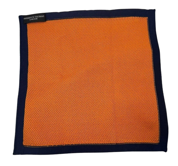 orange knitted pocket square with navy dark blue edging
